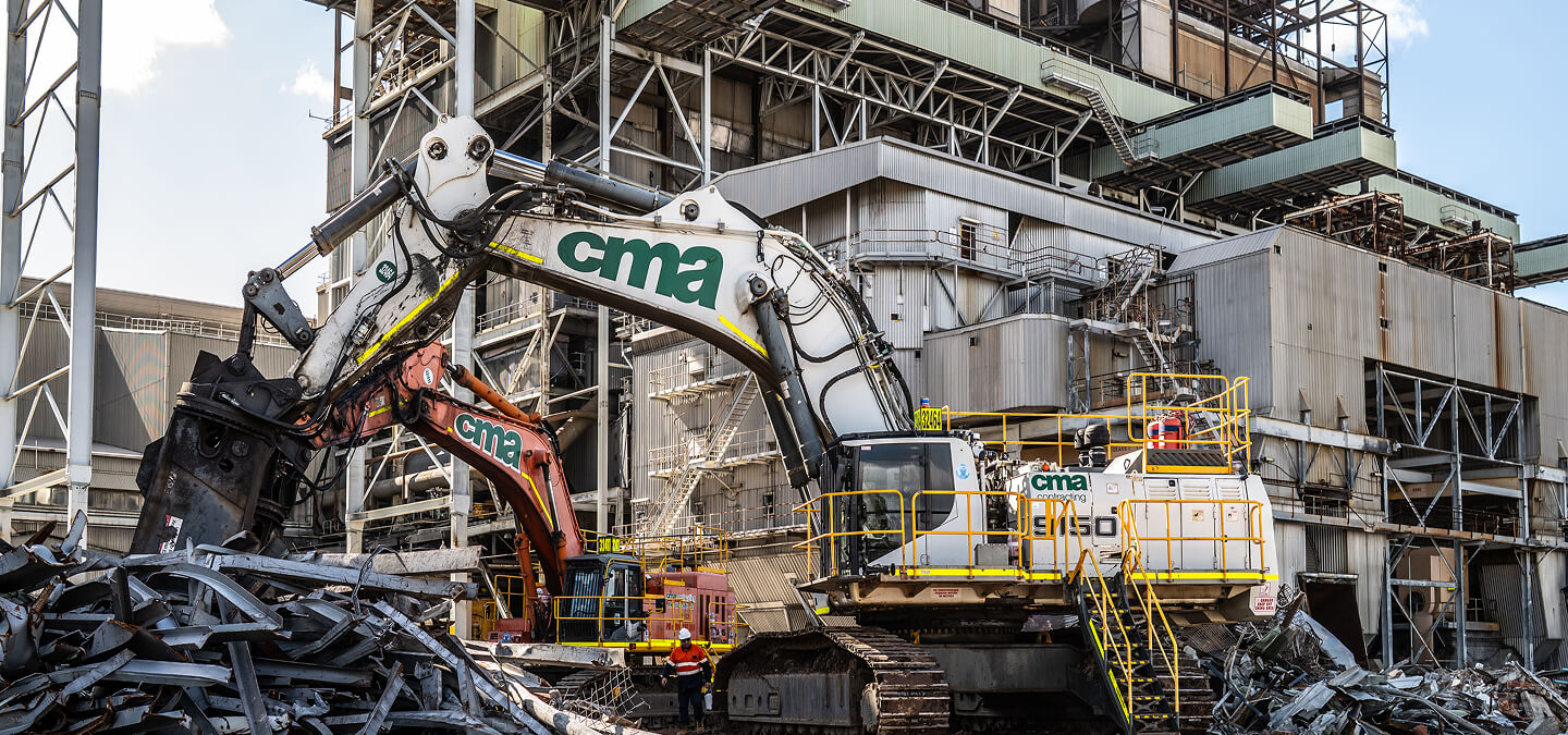 Construction equipment dismantling a structure