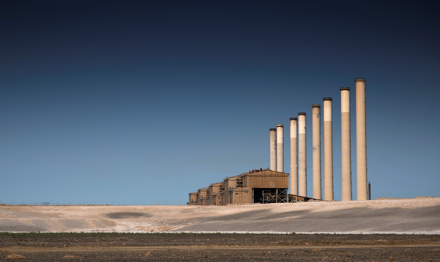 Silos on a barren landscape