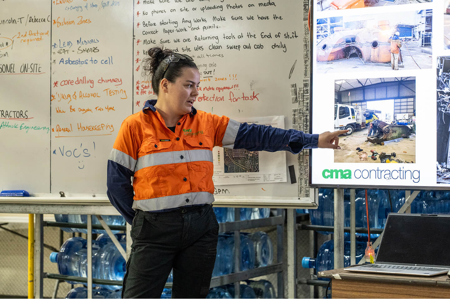Photo of a woman in CMA uniform leading a presentation